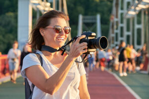 photographer with camera taking photo | photographer-with-camera-taking-photo | New Waves App Development
